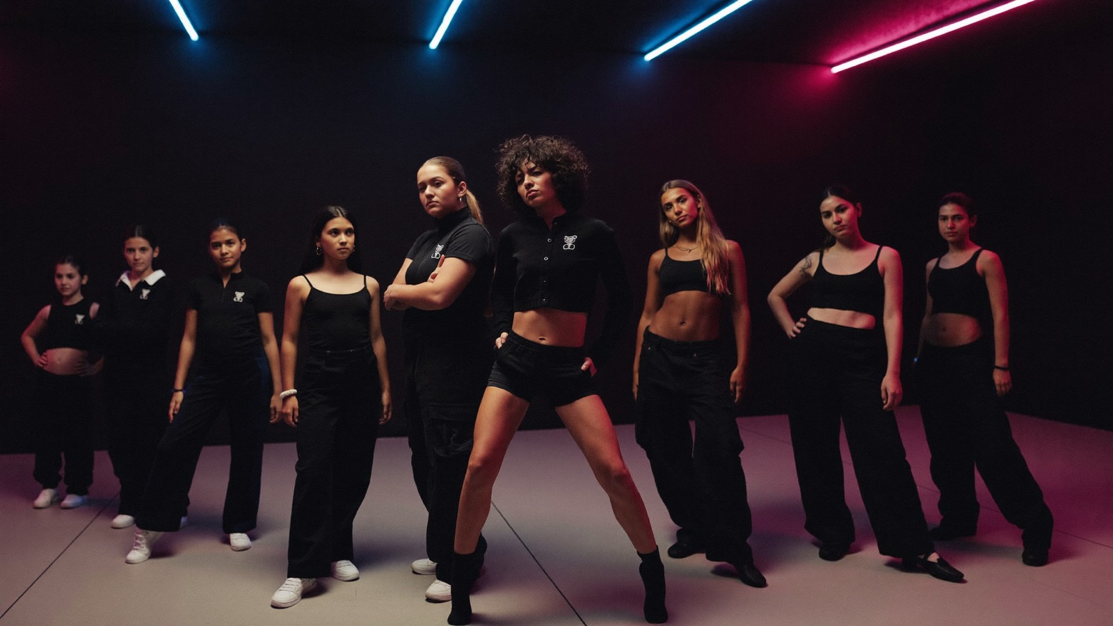 Dancers of every age mid-class on the main studio floor at New Era Studios